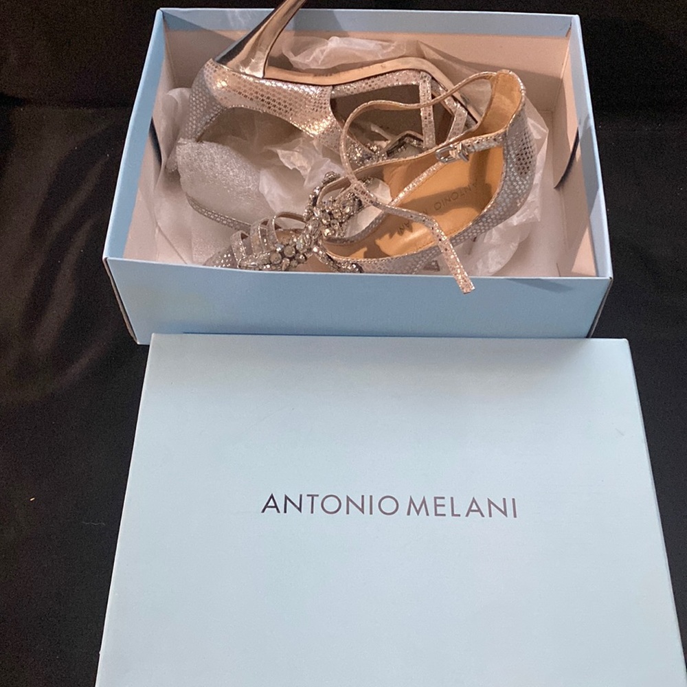 Used silver name brand shoe. Worn once.